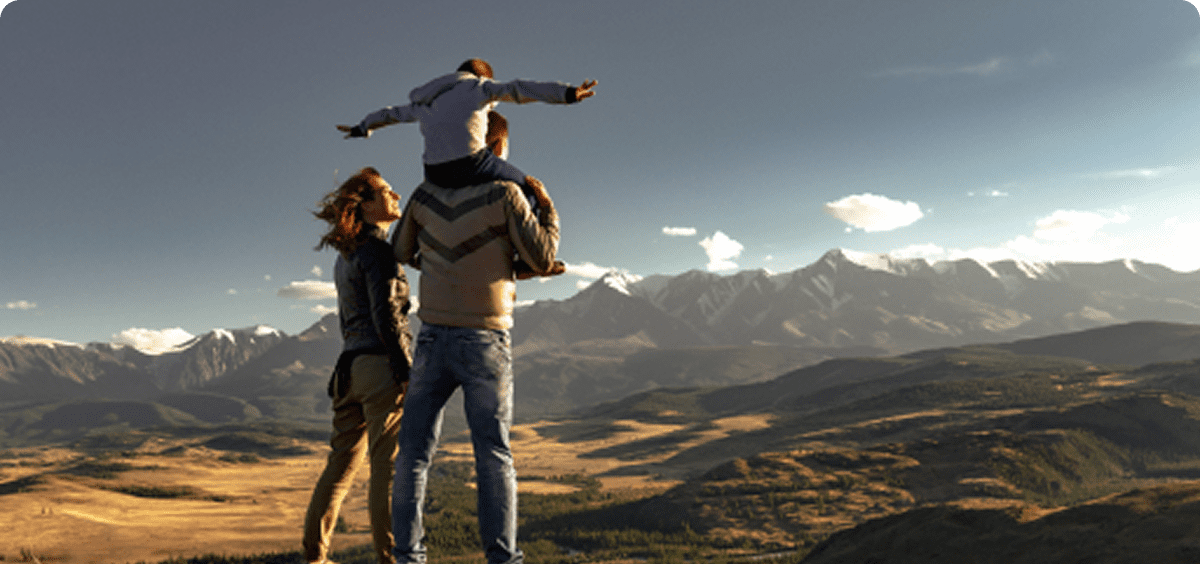 Parents with child on mountain
