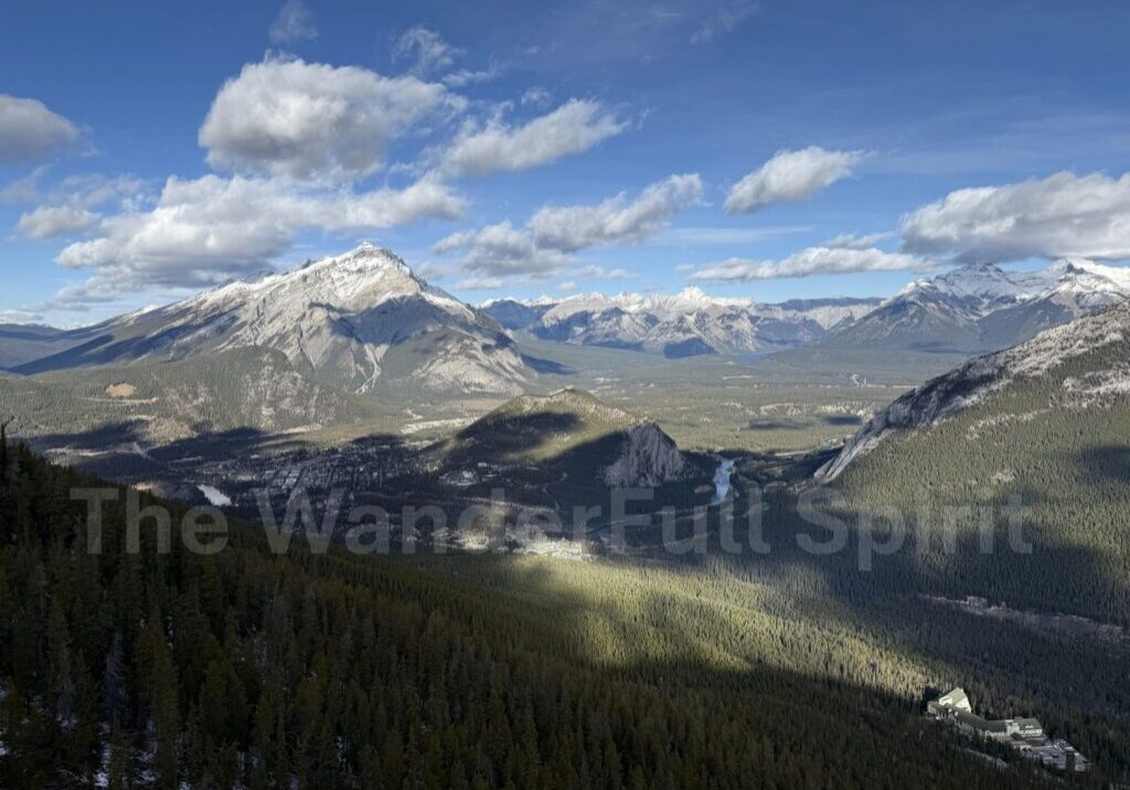 Sunlit mountains under blue sky