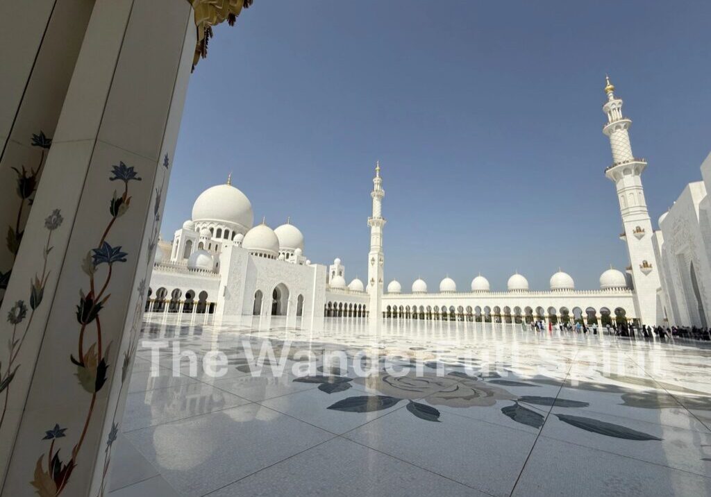Majestic mosque architecture under clear blue sky